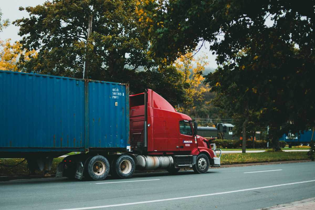 Land Transport Planning for Reliable Container Delivery Across Indonesia